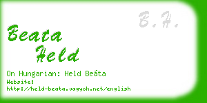 beata held business card